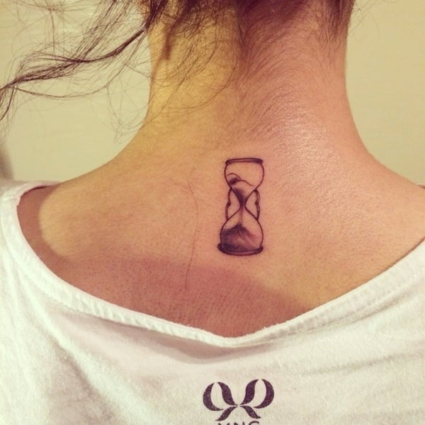 tiny hourglass tattoo on back 1