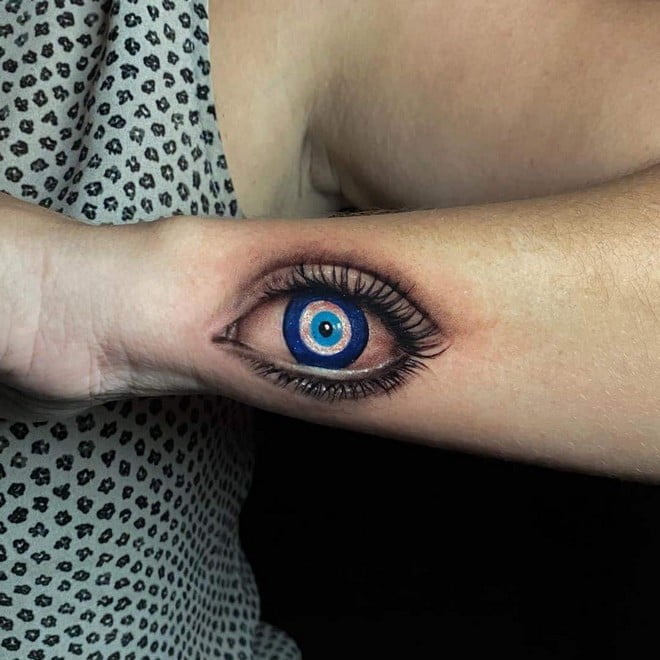 amazing evil eye tattoo on arm