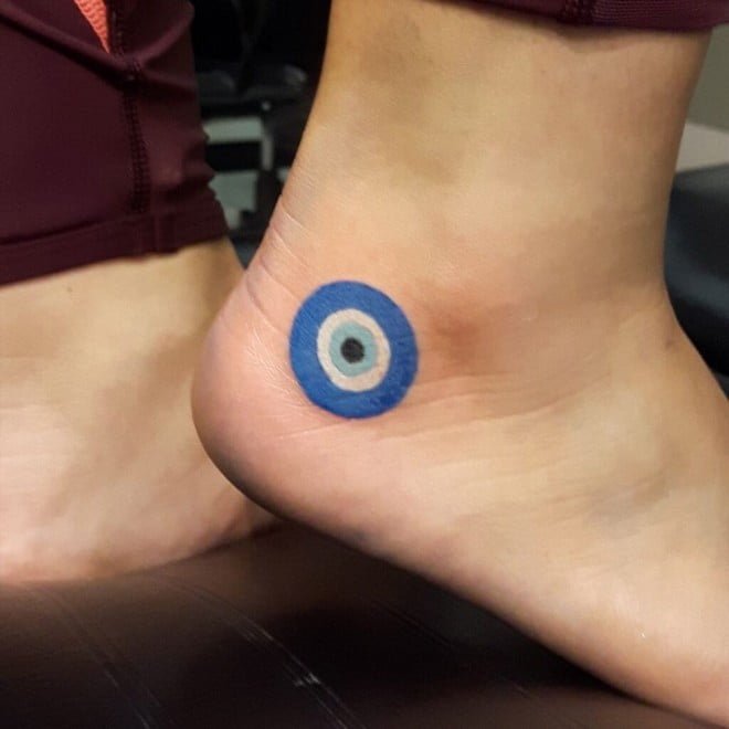 evil eye tattoo on foot