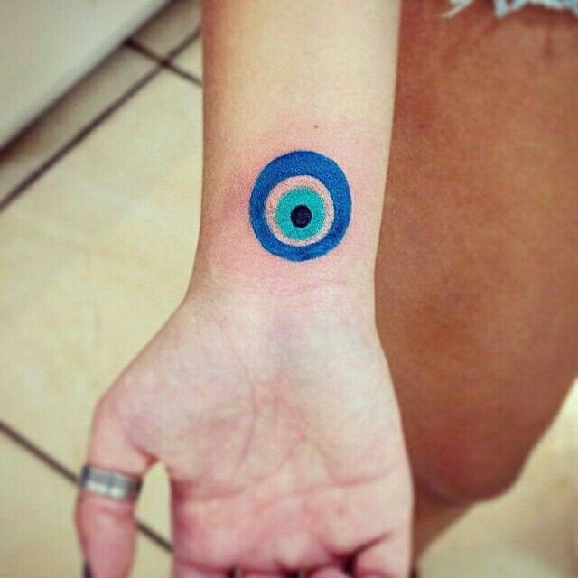 positive energy evil eye tattoo