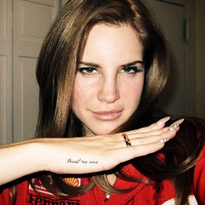 Lana del Reys trust no one tattoo on hand
