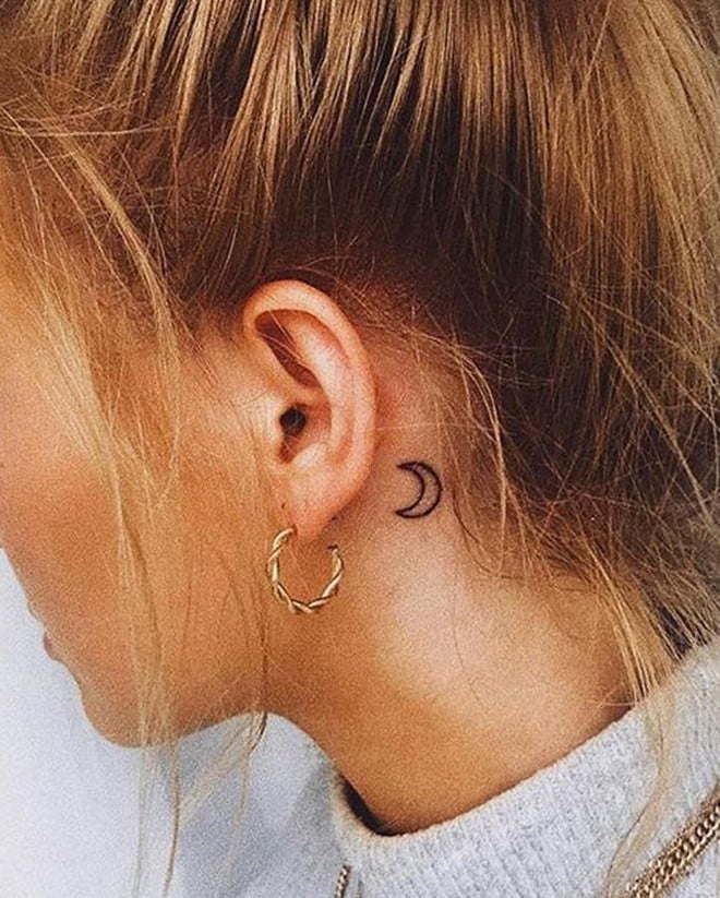 crescent moon tattoo behind ear