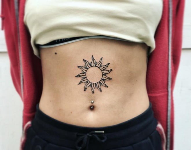 sun chest tattoo